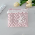 Detailed view of pink heart-quilted fabric pouch with lace trim and bow accent - Crinkle Pink Heart