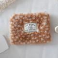 Macro shot of fluffy deer print plush pouch texture and black rabbit brand label - Deer Pattern Coin Purse