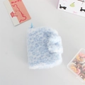 Close-up of blue leopard print plush coin purse with snap button and blue plastic hook - Blue
