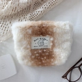 Close-up of plush fawn pattern makeup bag with soft faux rabbit fur and woven label - Snowflake Deer Pattern Lipstick Bag