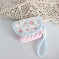 Detail of pink quilted fabric case with floral lid and pom-pom trim for CC camera - Crinkled Fabric Pink Heart Small Storage Pouch