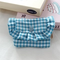 Detailed view of blue gingham ruffle mini pouch with button closure and rabbit label - Lake Blue Plaid