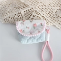 Detail of floral patterned padded camera case with pink pompoms and quilted fabric - Crinkled Fabric Blue Heart Small Storage Pouch