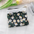 Detail of black pouch featuring white daisy embroidery, lace trim and pearl zipper slider - Black Embroidered Daisy / Black