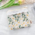 Close-up of daisy embroidery makeup bag with lace trim and elegant pearl zipper pull - Beige Embroidered Daisy / Off White