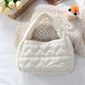 Close-up of cream heart-quilted handbag on lace with tulips for a fresh aesthetic - Quilted Large Heart Beige White