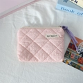 Detailed top view of pink quilted fabric coin purse with purple zipper pull on white surface - Quilted Pleated Light Pink
