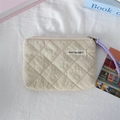 Detail of beige quilted coin purse with purple woven zipper pull and branded label - Quilted Pleated Khaki