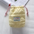Detail of quilted heart pattern on yellow camera pouch with pink drawstring - Quilted Large Heart Yellow