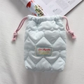 Detail of light blue quilted heart camera pouch with pink drawstring and soft fabric - Quilted Big Heart Light Blue