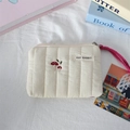 Detailed view of white quilted coin purse with red mushroom embroidery and pink strap - Quilted Embroidered Mushroom