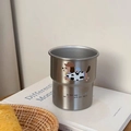 Detailed macro view of the stainless steel cup with a cute cartoon dog illustration - Silver Cow Dog