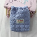 Close-up of quilted heart camera pouch with blue stripes and drawstring closure - Crepe Striped Heart Blue