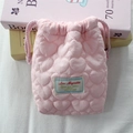 Close-up of pink quilted camera bag featuring heart patterns and soft drawstring closure - Quilted Small Heart Pink