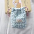 Detailed view of blue gingham quilted camera pouch with pink drawstring and heart pattern - Checkered Heart