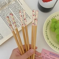 Five pairs of wooden chopsticks featuring green checkerboard and cherry patterns - Cherry (1 Pair)