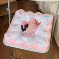 Detail of pink floral plush seat cushion with cartoon prints on a white chair - Pink Heart Seat Cushion
