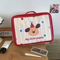 Detail of the cute cartoon puppy travel bag with red handles and smooth zipper closure - One Dog