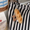 Portachiavi creativo a forma di baguette in peluche appeso a una borsa di tela a righe - Ciondolo Baguette Marrone