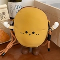 Detail view of the yellow cartoon potato bag with fun boxing glove arms and woven strap - Large Crossbody Bag