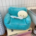 Detail of light blue plush tissue box in sofa shape with cute character on books - Large Size - Tissue Drawer