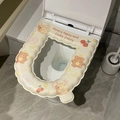 Waterproof EVA toilet seat cushion in beige with cute cartoon bear and dog patterns - Goodnight Bear