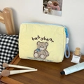 Quilted cotton makeup bag with cute plush bear embroidery and blue zipper detail - Yellow Bear