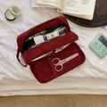 Macro view of burgundy multi-layer nylon pencil case showing mesh pocket storage - Burgundy