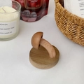 Detailed view of mushroom-shaped solid wood wall hook with natural grain and smooth finish - Walnut