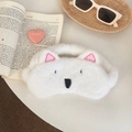 Close-up of cute white plush dog sleep mask with embroidered eyes and ears detail - West Highland Style