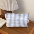 Detail of blue and white checkered bag with delicate bow embroidery and woven brand label - Grey Striped (03) / Small