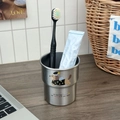 Close-up of stainless steel dachshund cup with toothbrush and paste on wooden surface - Silver Angel Dog