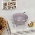 Detail view of a purple ceramic bowl featuring a 3D cat figurine on the rim and embossed finish - Purple Cat