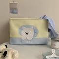 Detail of canvas storage basket featuring cute puppy print and yellow-blue color block - Westie