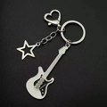 Detailed close-up of a Y2K silver electric guitar keychain with a hollow star charm - White Guitar Keychain [Style 1]