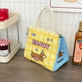 Detailaufnahme der gelb karierten Cartoon-Lunchtasche mit dicker Alu-Isolierung und Tragegriff - Dackel