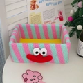 Detailed view of pink and green striped plush clown storage box with 3D facial features - Blue and Pink Stripes