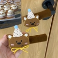 Brown plush bear-shaped door handle covers with polka dot hats and yellow bows - Spotted Bear / Left Opening