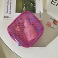 Detail of pink and blue mesh cosmetic bag with zipper and logo tag on white desk - Rose Red