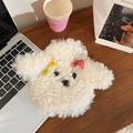 Detail of cute white plush dog water bottle cover with red bow on wooden desk - White