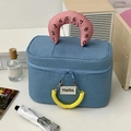 Macro detail of navy blue canvas makeup bag with pink numeric handle and yellow spiral decor - Denim Blue (Includes Hair Tie)