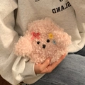 Pink plush poodle hot water bottle cover with cute bow and button details in hand - Pink