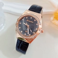 Detailed view of rose gold rhinestone bezel and grey sunray dial on a quartz watch - Black