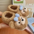 Detailed view of plush monkey slippers featuring a blue checkered bow and soft texture - 40-41 / Brown Full-back