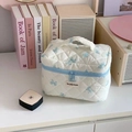 Quilted makeup bag with light blue bow patterns and top handle for travel storage - Large / Korean Style Bow Blue
