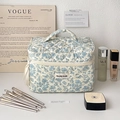 Quilted bow makeup bag in cream with blue floral print and metal zipper closure - Large / Blue Floral