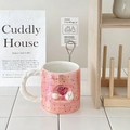 Detail view of pink ceramic mug featuring 3D heart puppy and iridescent woven handle - 320ml / Heart Dog