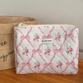 Quilted floral makeup bag with pink bow ribbon and rose print in creamy white finish - Pink Bow Flower (Clutch Bag - Medium)