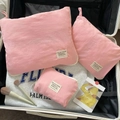 Pink 3-piece nylon travel organizer set nested in a suitcase for luggage storage - Small / Pink
