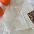 Close-up of heat-resistant glass straw featuring delicate pink tulip floral patterns - Halo Tulip